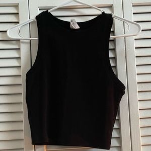 Size large black cropped tank top from Tilly’s.